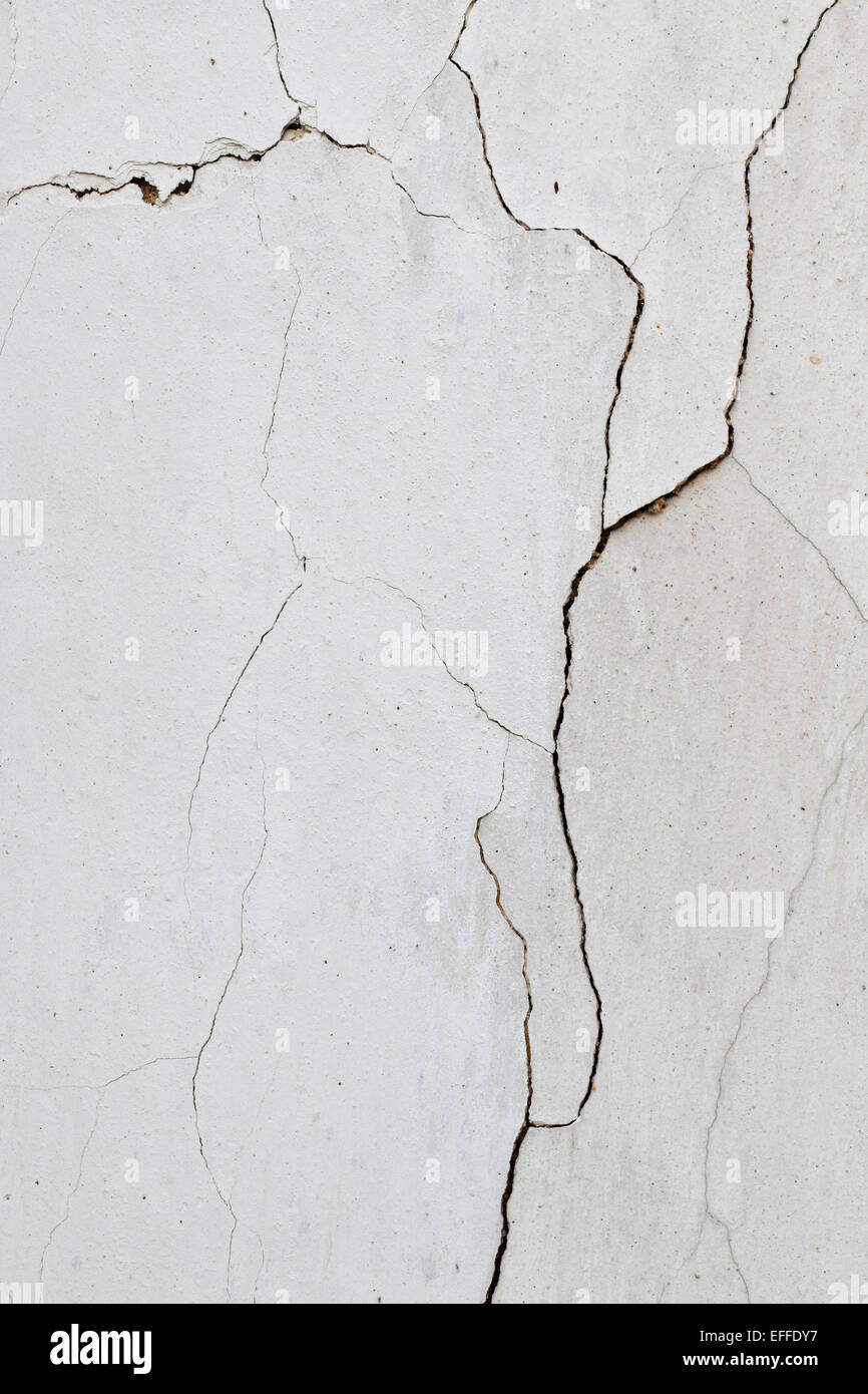 Cracked plaster - fine cracks - compound fissure - grunge background Stock Photo