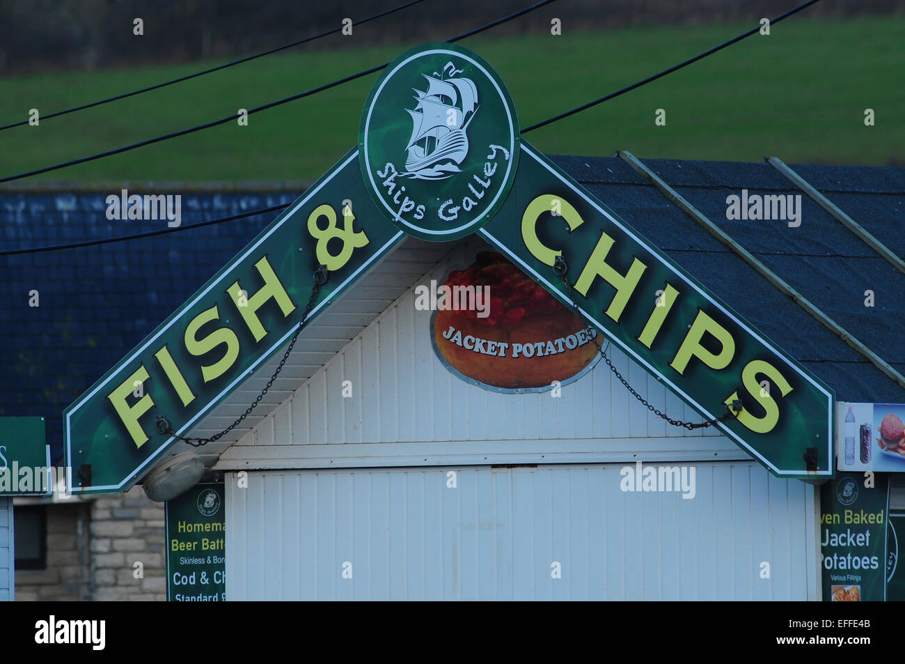 A fish and chip sign at West Bay Dorset UK Stock Photo