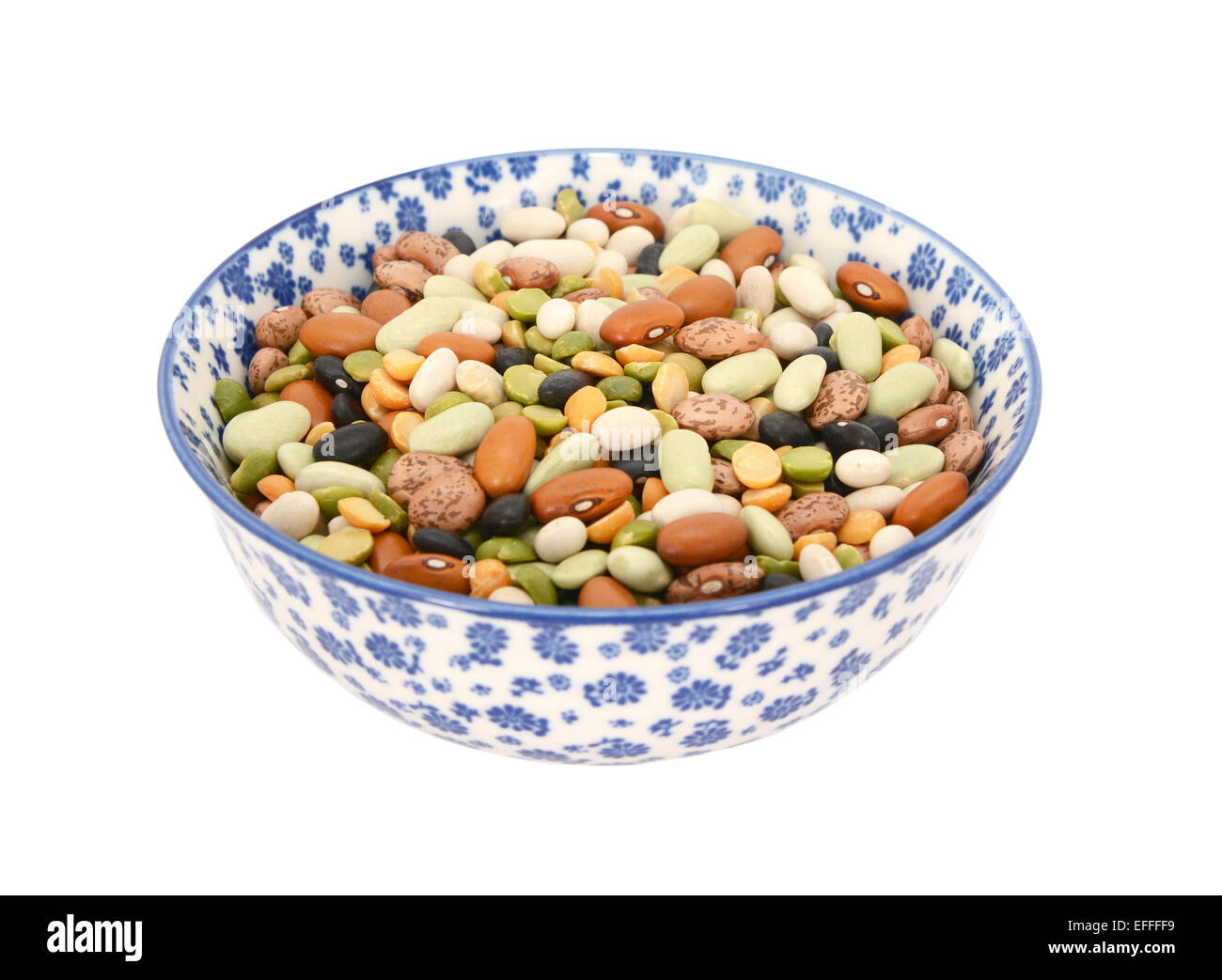 Mixed dried beans in a blue and white porcelain bowl with a floral