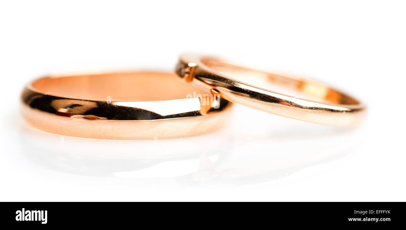 Gold wedding rings isolated on white background Stock Photo - Alamy