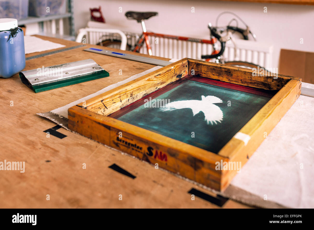 Close-up of screen printing frame on table in bag factory Stock Photo