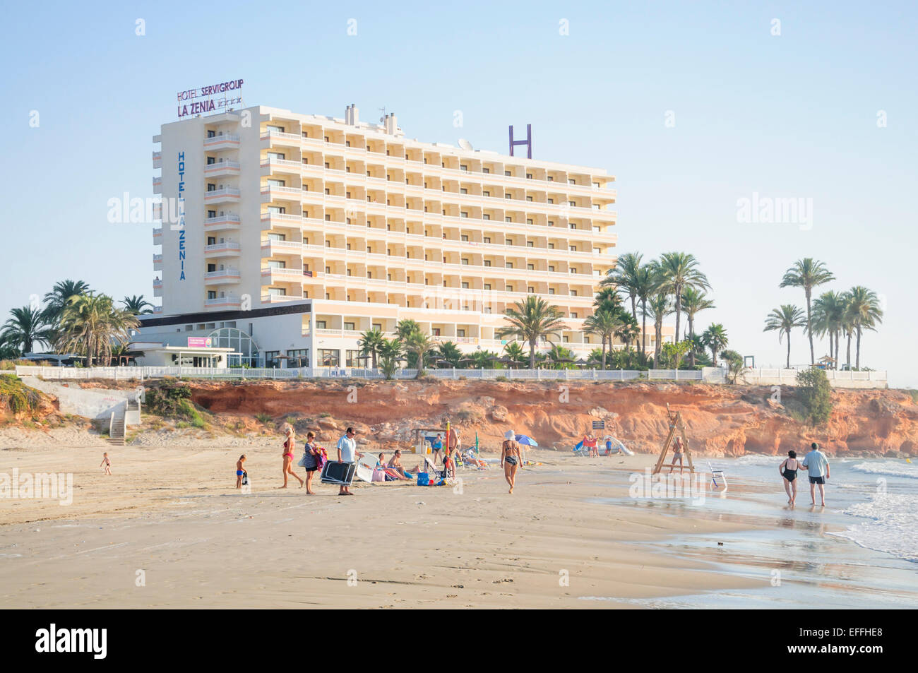 LA ZENIA, COSTA ORIHUELA, SPAIN ON JULY 24 2012: Tourists finding a place  on the beach by Hotel La Zenia, La Zenia Beach on July Stock Photo - Alamy