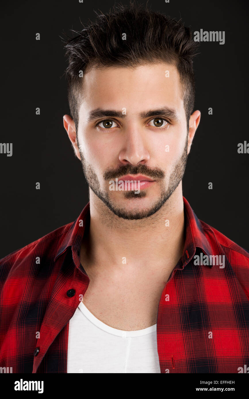 Studio portrait of a handsome young man Stock Photo - Alamy