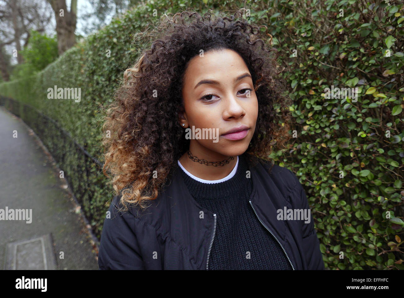 united kingdom london regents park portrait of a young and fashionable mixed race girl Stock Photo