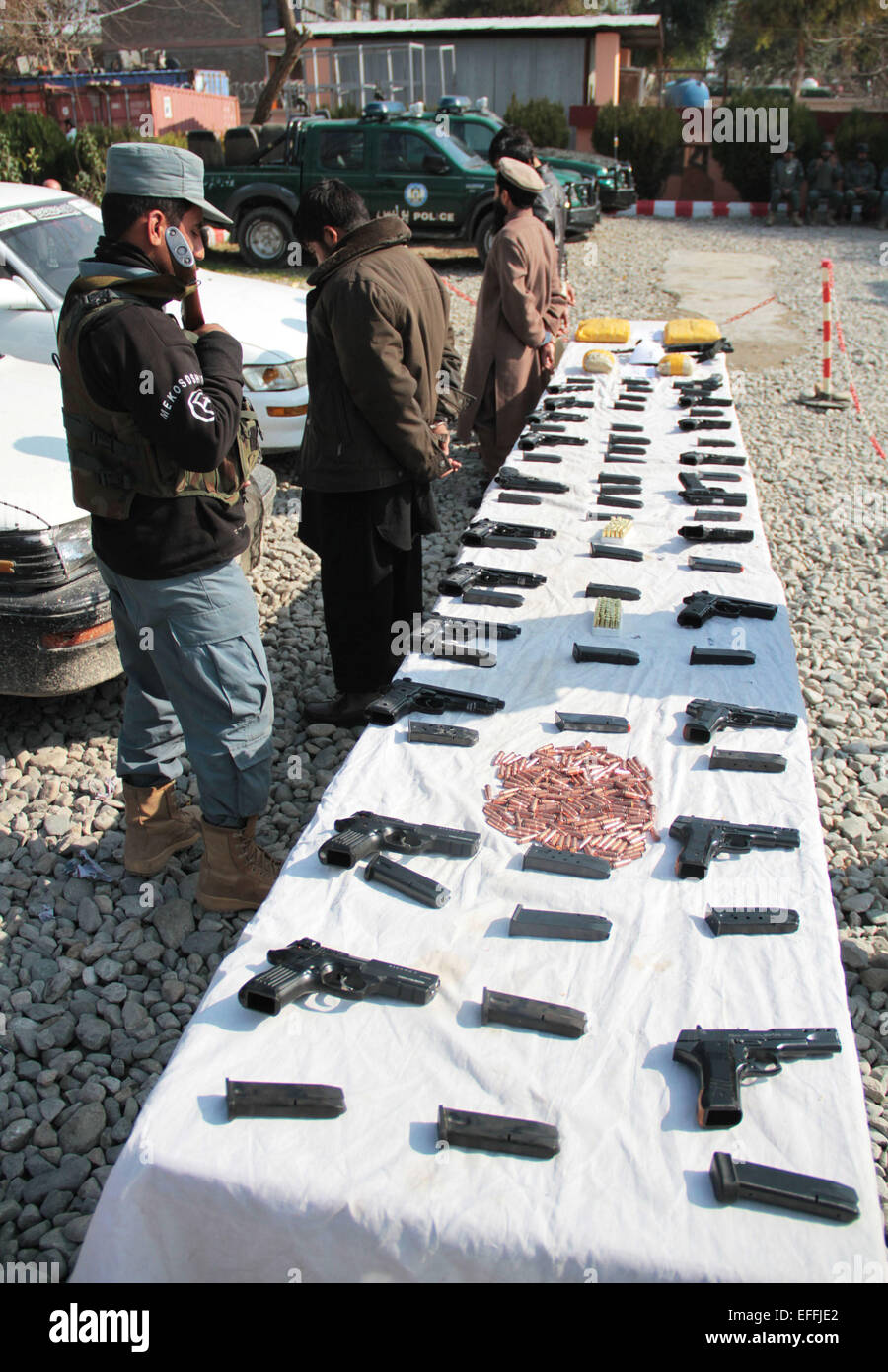 Nangarhar, Afghanistan. 3rd Feb, 2015. Drug smugglers stand handcuffed