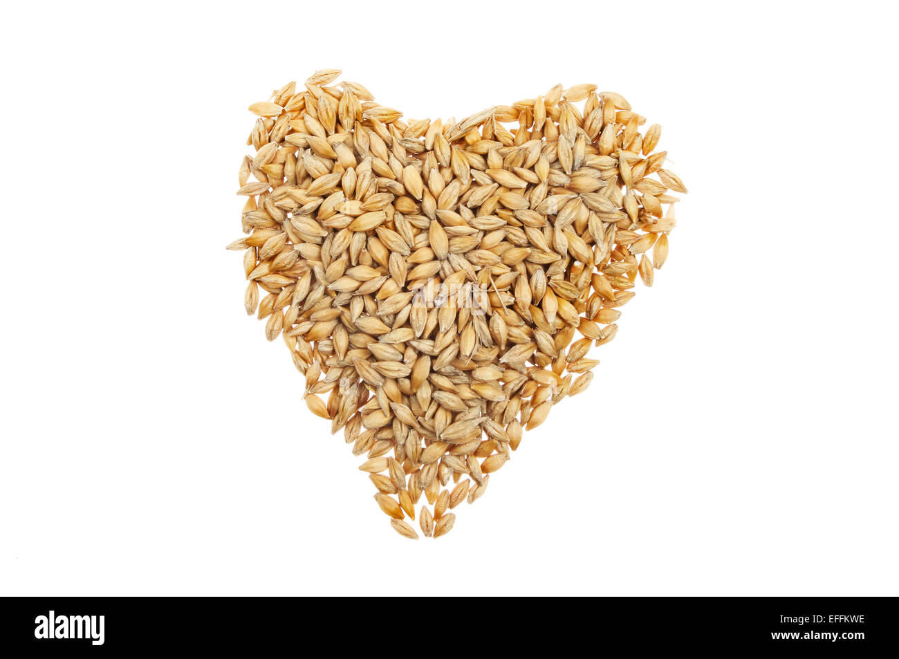 Grains of wheat in a heart shape isolated against white Stock Photo