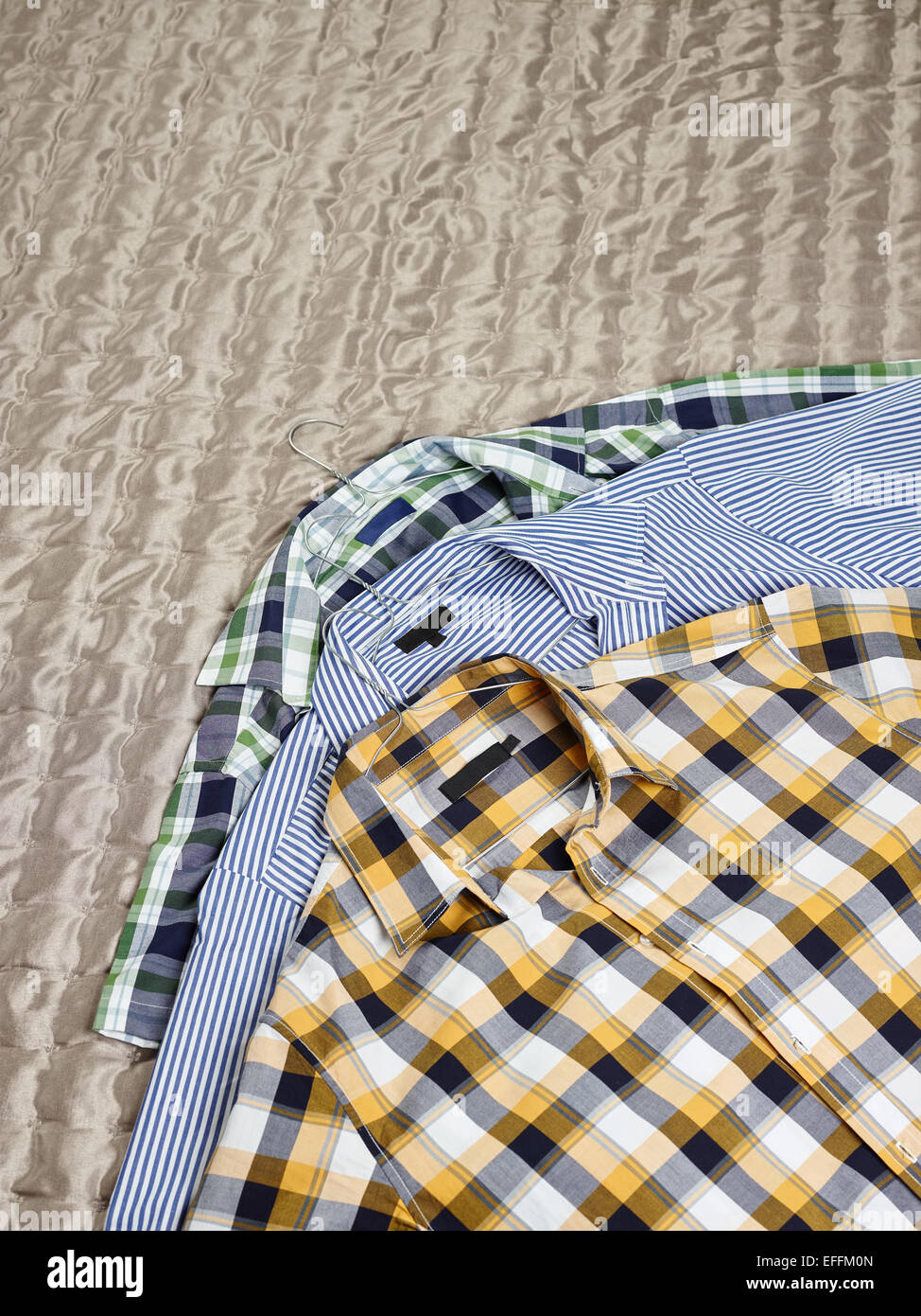 Men's casual patterned shirts on the bed Stock Photo Alamy