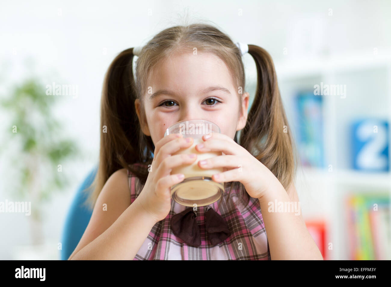 kid drinking milk from glass Stock Photo Alamy