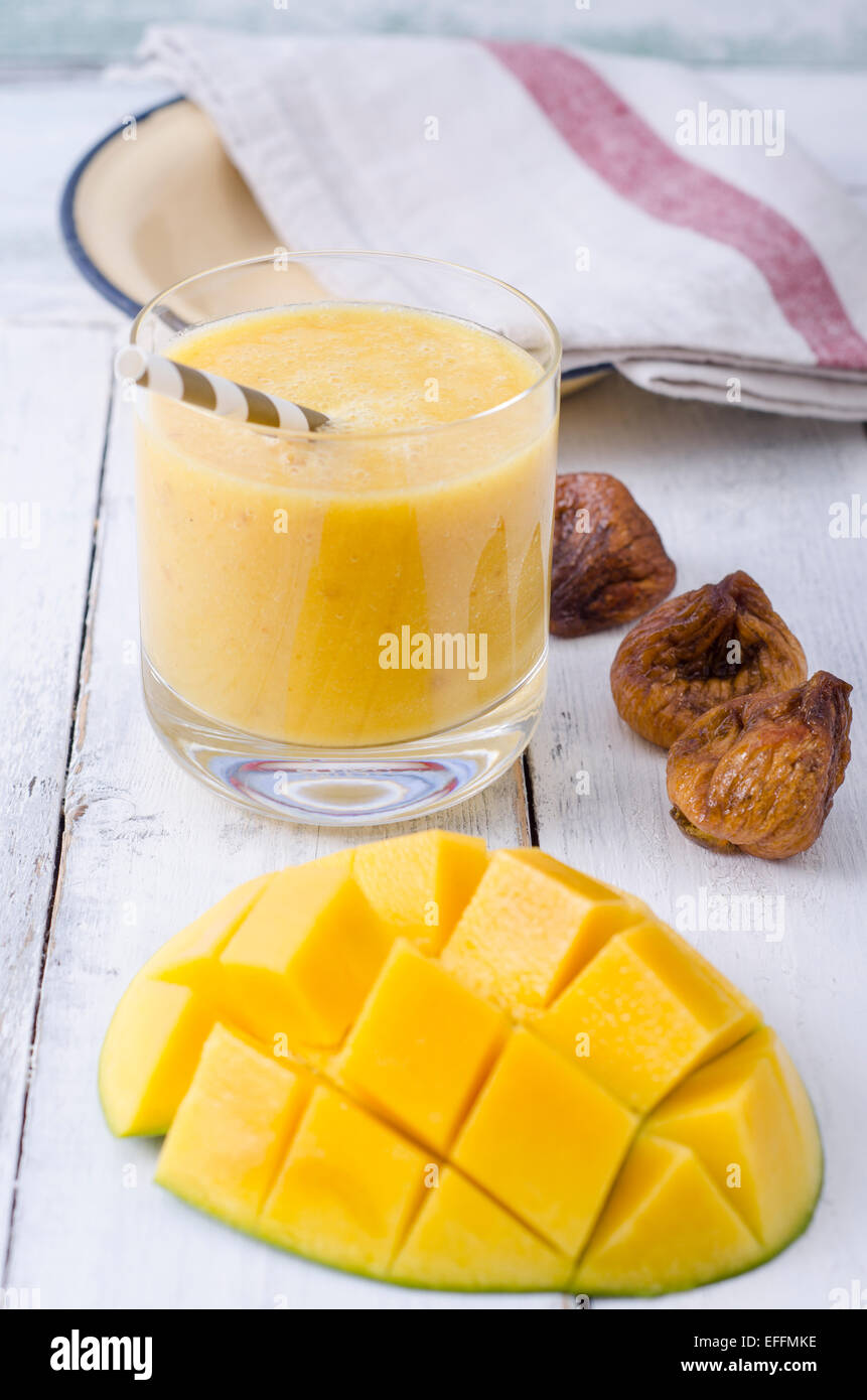 Mango smoothie and dried figs Stock Photo Alamy