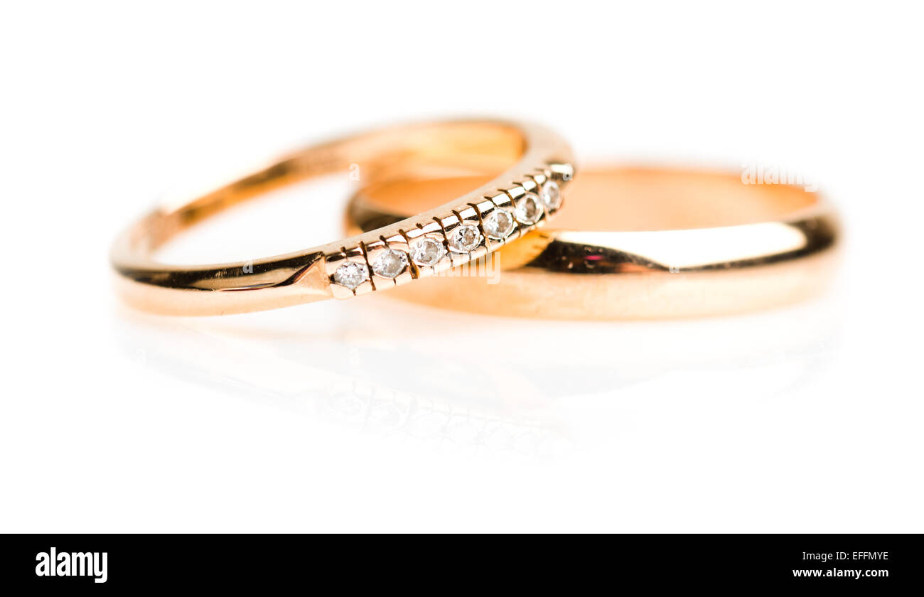 Gold wedding rings isolated on white background Stock Photo - Alamy