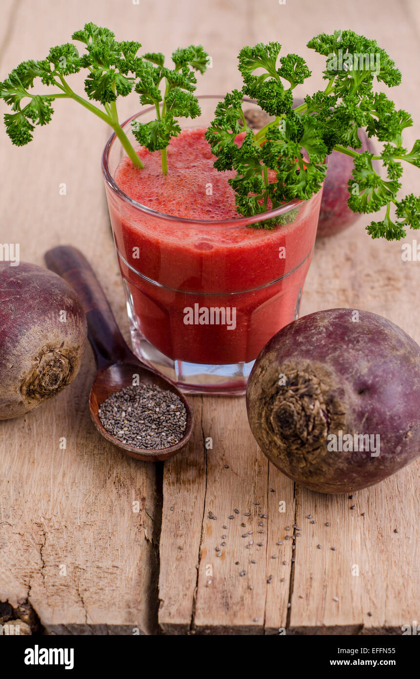 Glass of beetroot smoothie with chia seeds and frizzy parsley Stock Photo