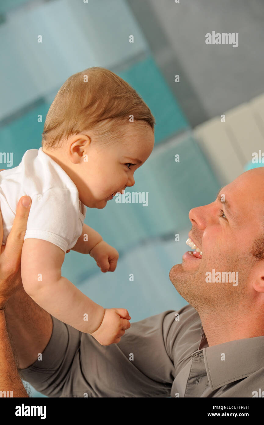 Father playing with his little baby. Quality time father and daughter. Stock Photo