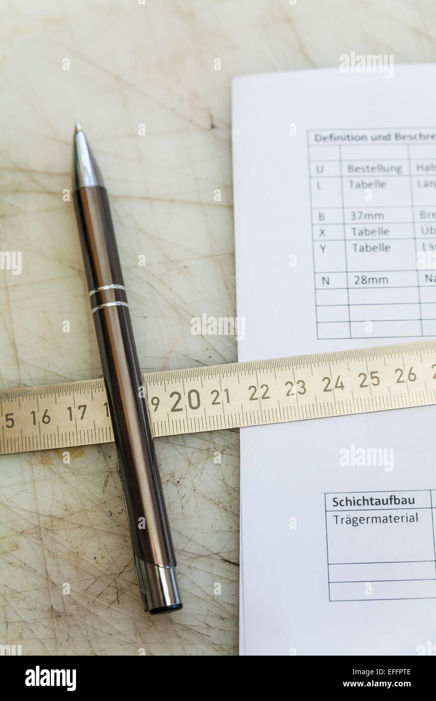 Metal ruler and pen on construction spreadsheet Stock Photo