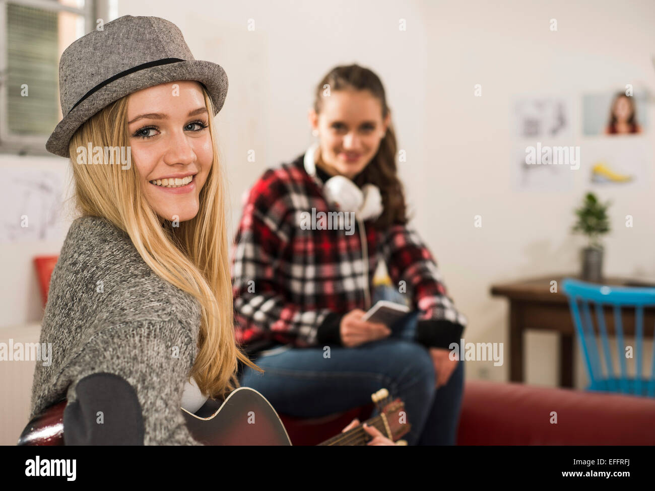 Portrait of smiling blond teenage girl at home Stock Photo Alamy