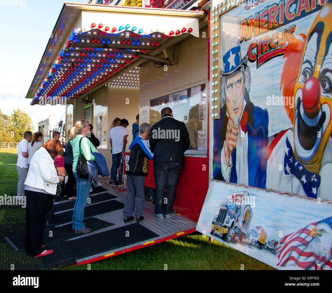 People queuing to buy tickets at the box office at Uncle Sams Great American circus. Stock Photo