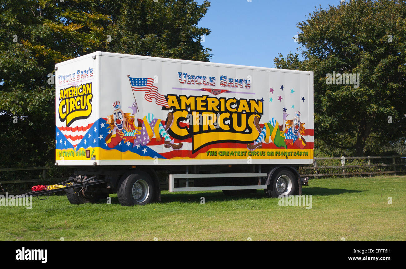 Trailer from Uncle Sam's Great American Circus in a green field with a blue sky. Stock Photo