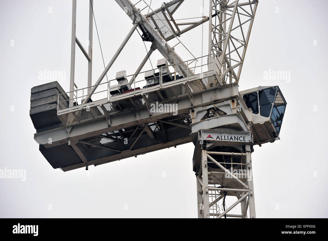 A tall white construction tower crane working in Toronto, Canada Stock