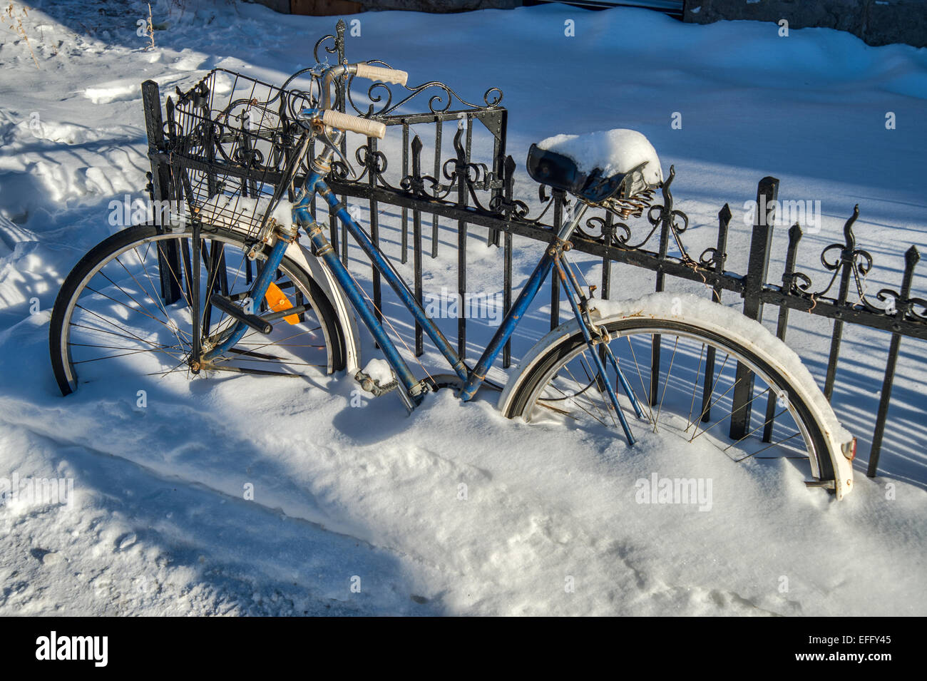 Bike covered with fresh snow in Montreal Stock Photo