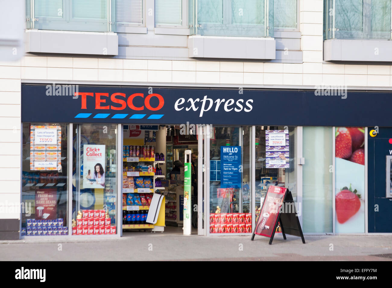 Tesco Express store, shop front exterior entrance, at Royal Victoria Dock, London, UK in February Stock Photo
