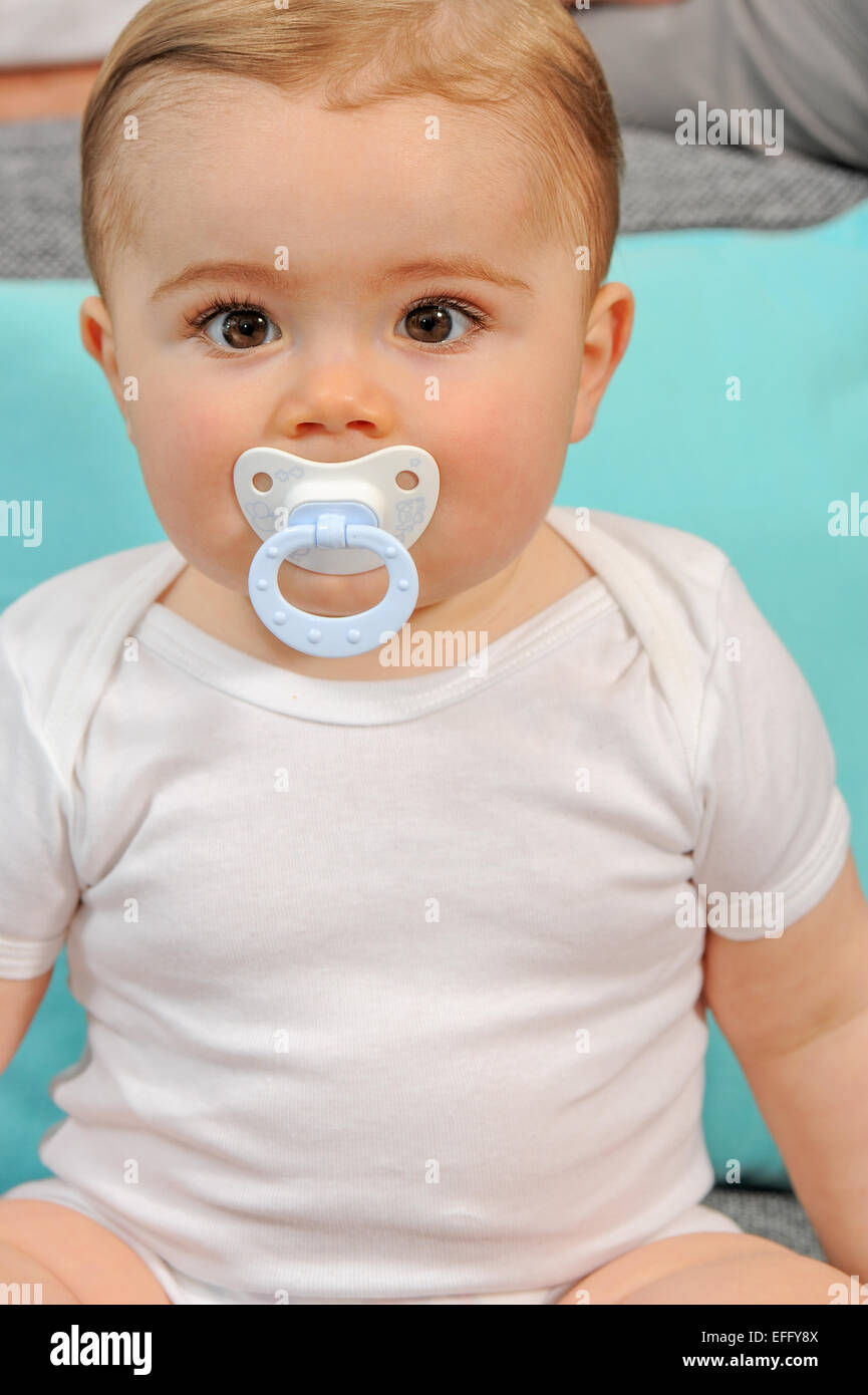 Cute baby pacifier looking camera hires stock photography and images