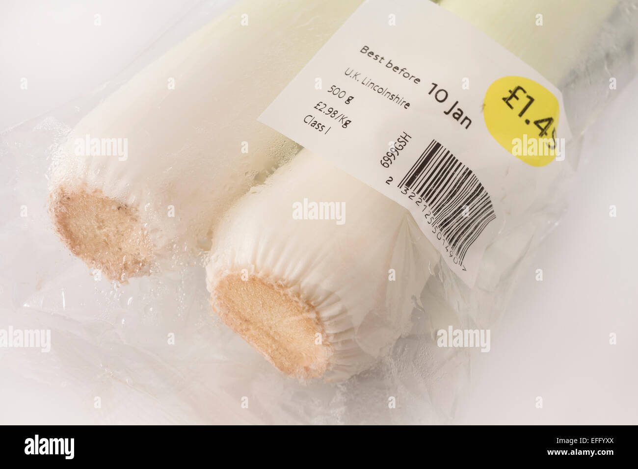Leeks From a Major UK Supermarket Sweating Inside Unnecessary Plastic Packaging With Best Before Date Stock Photo