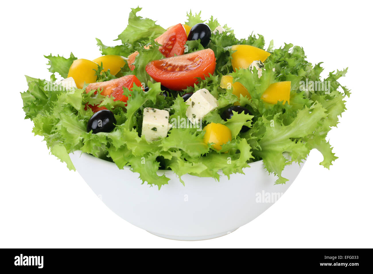 Salad with tomatoes, paprika, Feta cheese and olives in bowl isolated Stock Photo