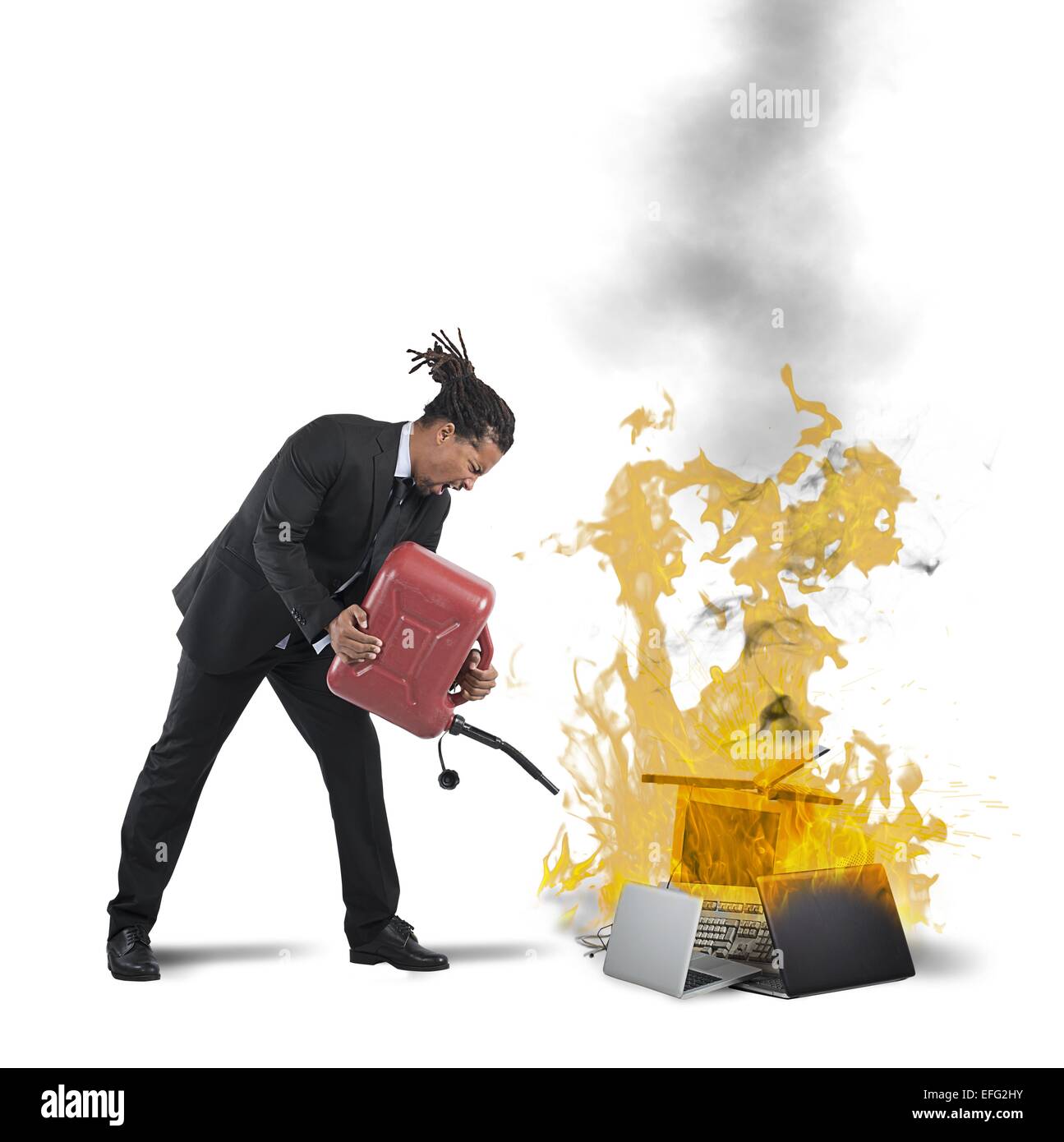 Businessman burns computers Stock Photo