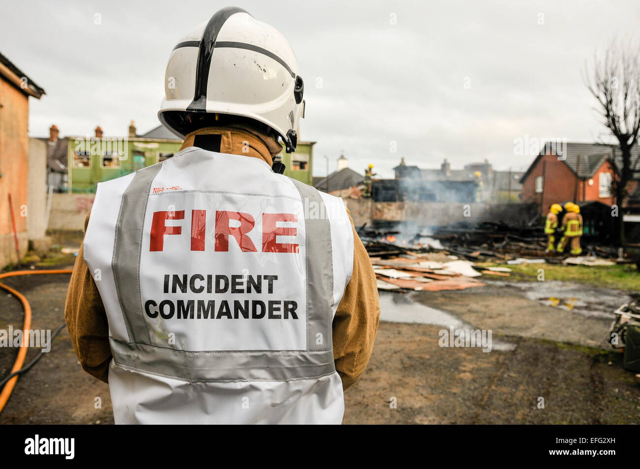 Carrickfergus, Northern Ireland. 03 Feb 2015 - A Fire Incident Commander watches as firefighters tackle a blaze which has destroyed a building. Credit:  Stephen Barnes/Alamy Live News Stock Photo