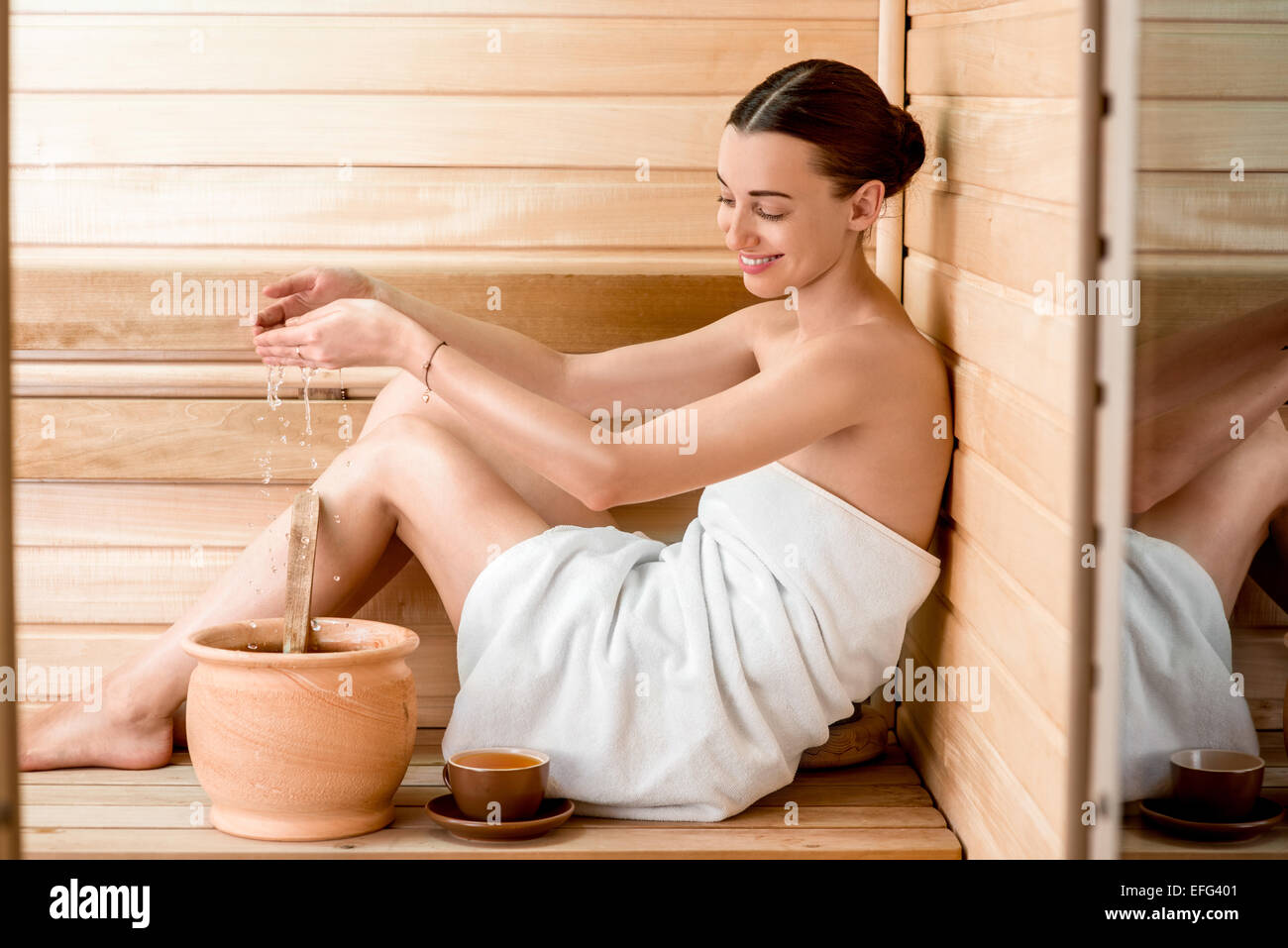 Woman in sauna Stock Photo