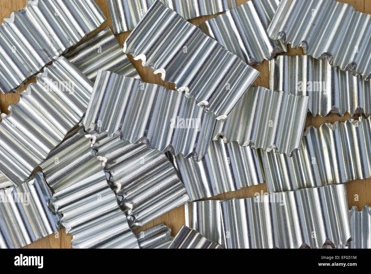 Close view of a group of corrugated steel fasteners for cabinetry and picture frames. Stock Photo