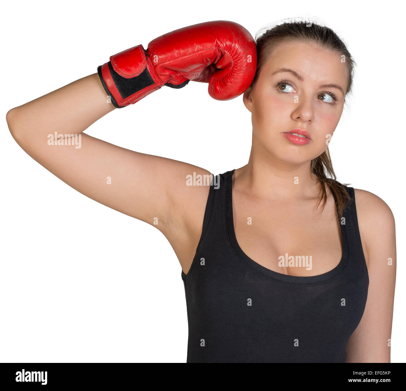Woman holding boxing glove at her temple Stock Photo