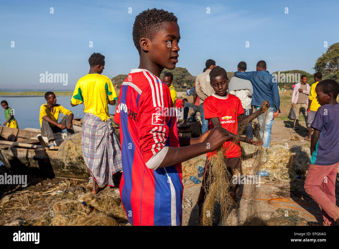Local Boys Mending Fishing Nets, The Fish Market, Lake Hawassa, Hawassa, Ethiopia  Stock Photo - Alamy