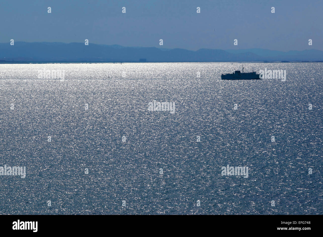 Ship In the morning light on the sea Stock Photo