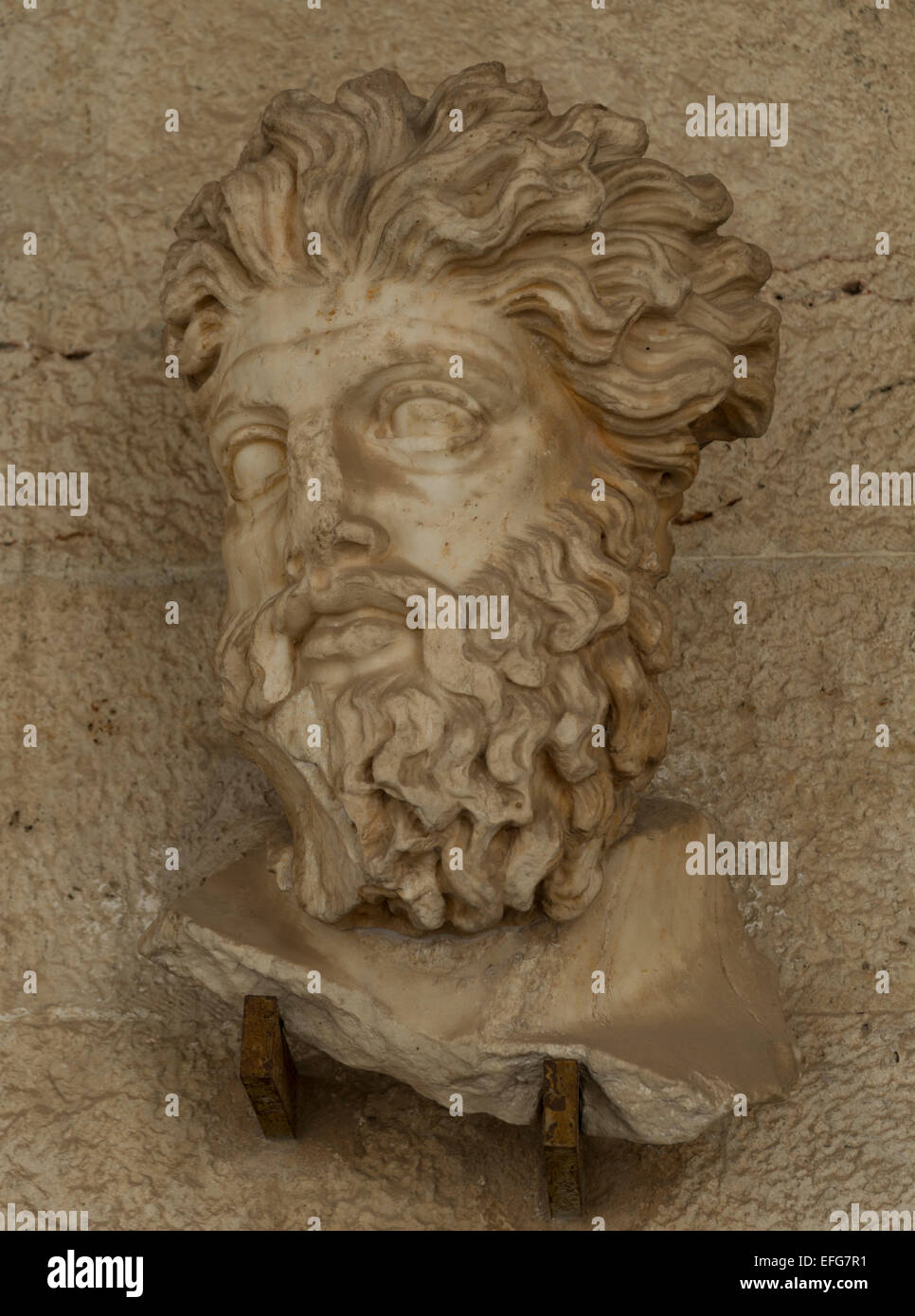Head of a Triton. Marble sculpture. Mythological Greek god, son of Poseidon. Stock Photo