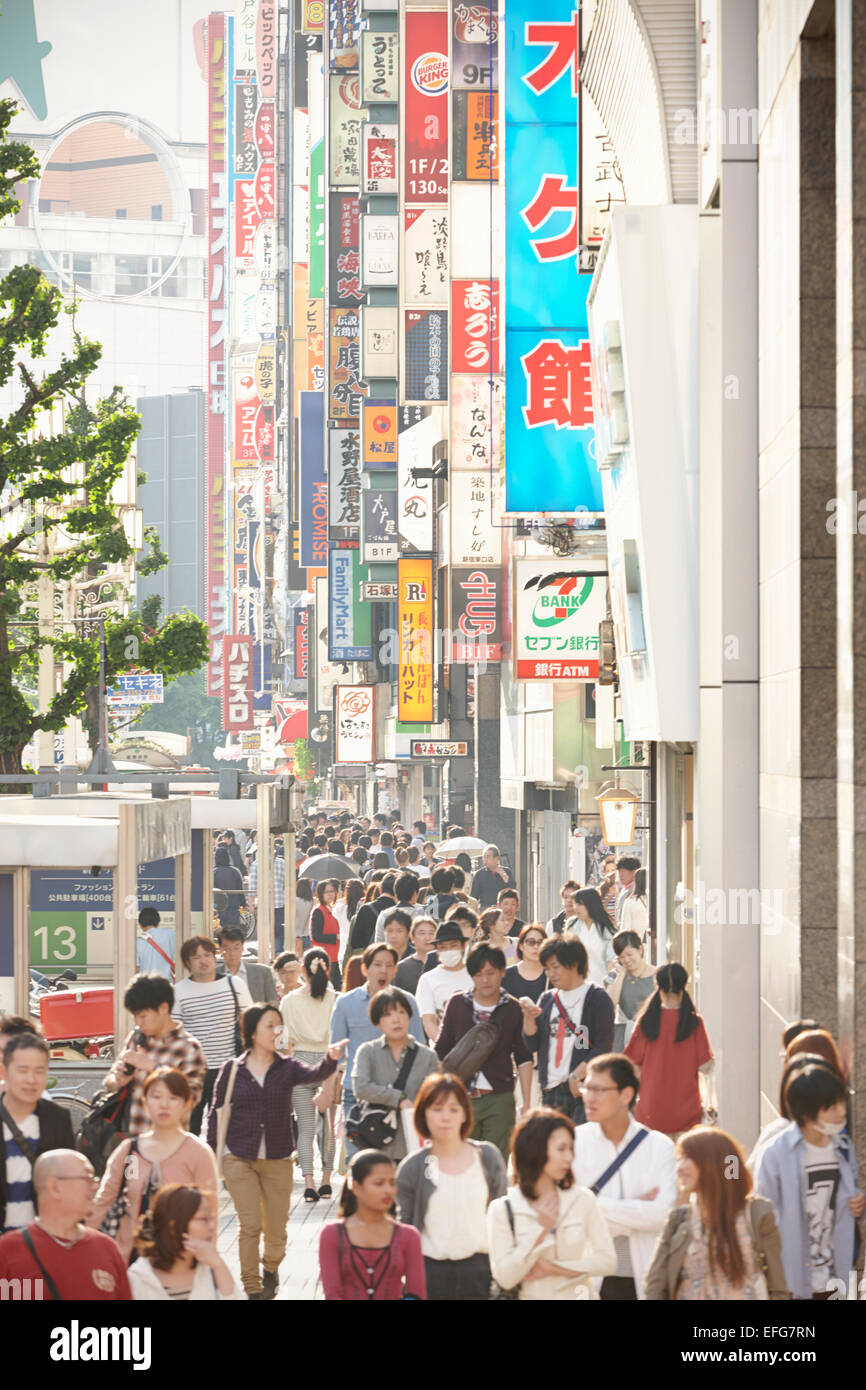 Pedestrians on Yasukuni-dori, Shinjuku, Tokyo, Japan Stock Photo