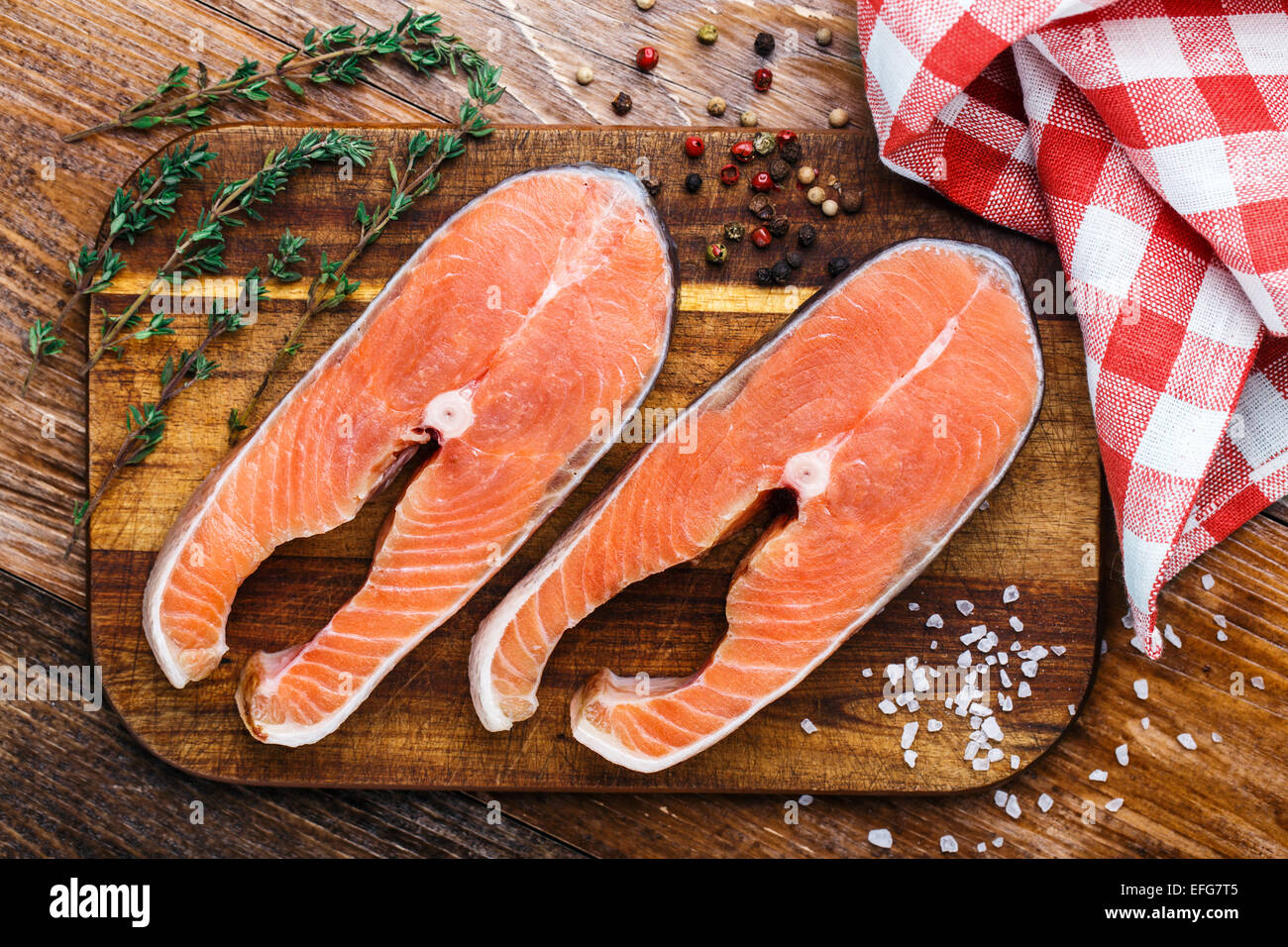 Salmon steak on a wooden board Stock Photo