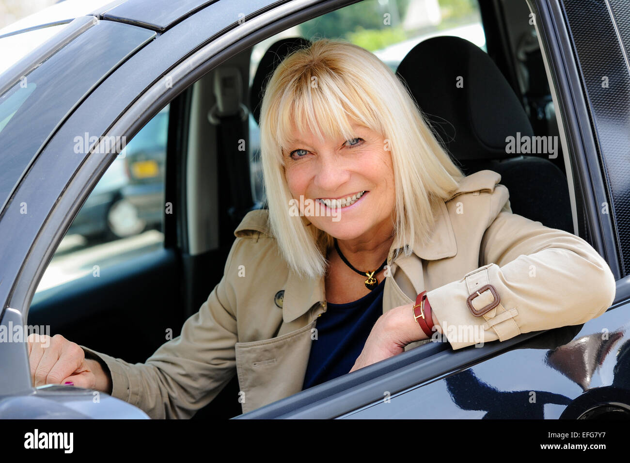 A senior woman at the wheel of her car. Stock Photo