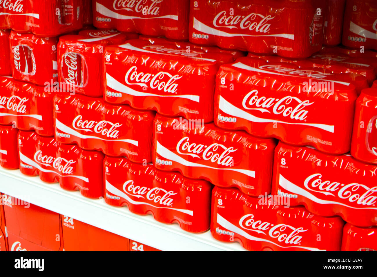 cans of coca cola drinks on sale in a sainsburys supermarket in england Stock Photo Alamy