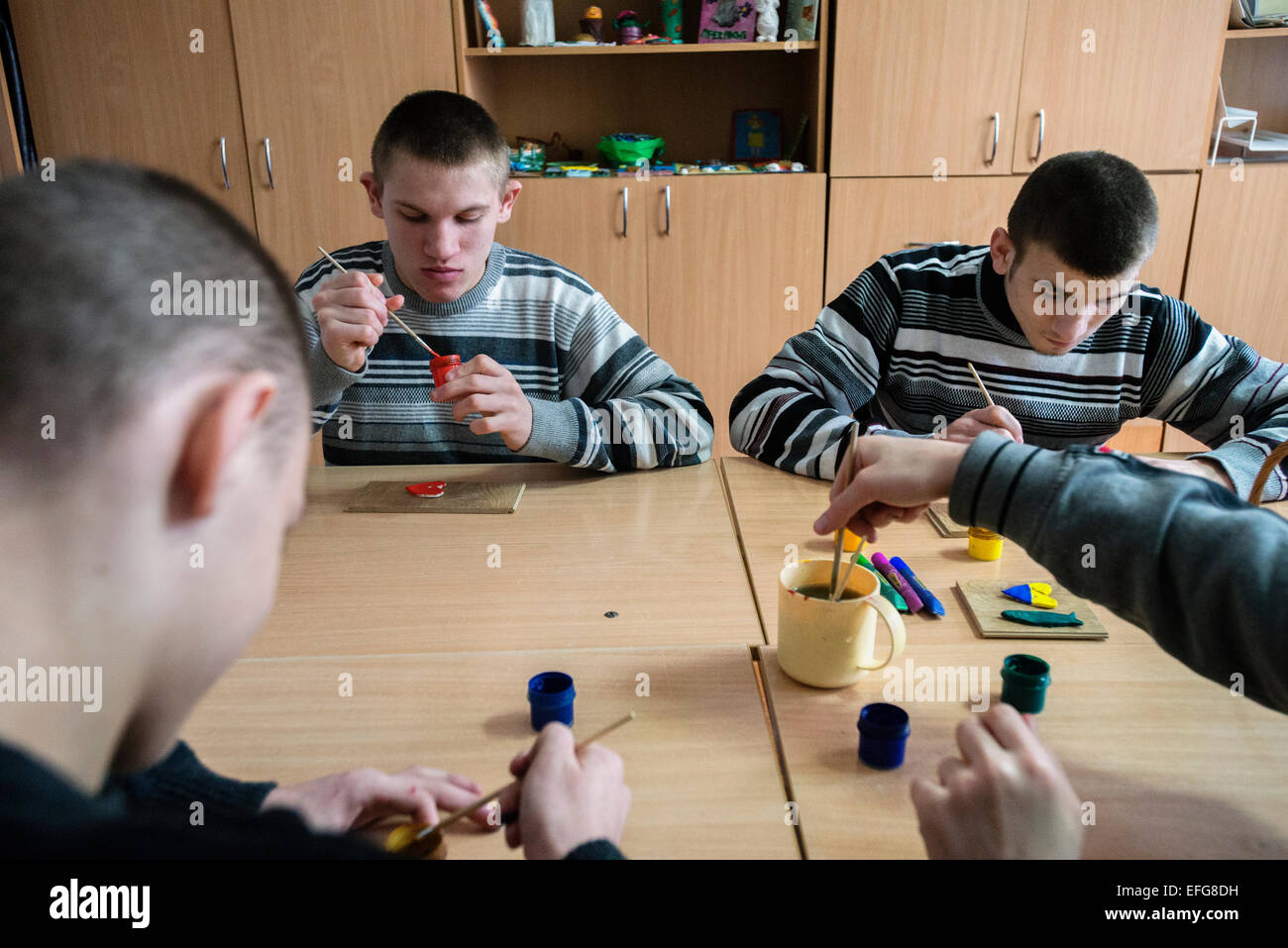 Zhytomyr, Ukraine. 2 of February, 2015. Teterivka's Orphanage and Boarding school has 85 pupils with mental and intellectual disorders, that can't manage without medical and specialists care. Governmental founding is sole way of founding for orphanage. Boys with mental disorders paint their sculptures made of salt dough, Teterivka's Orphanage and Boarding school. Zhytomyr, Ukraine. 2 of February, 2015. Credit:  Oleksandr Rupeta/Alamy Live News Stock Photo