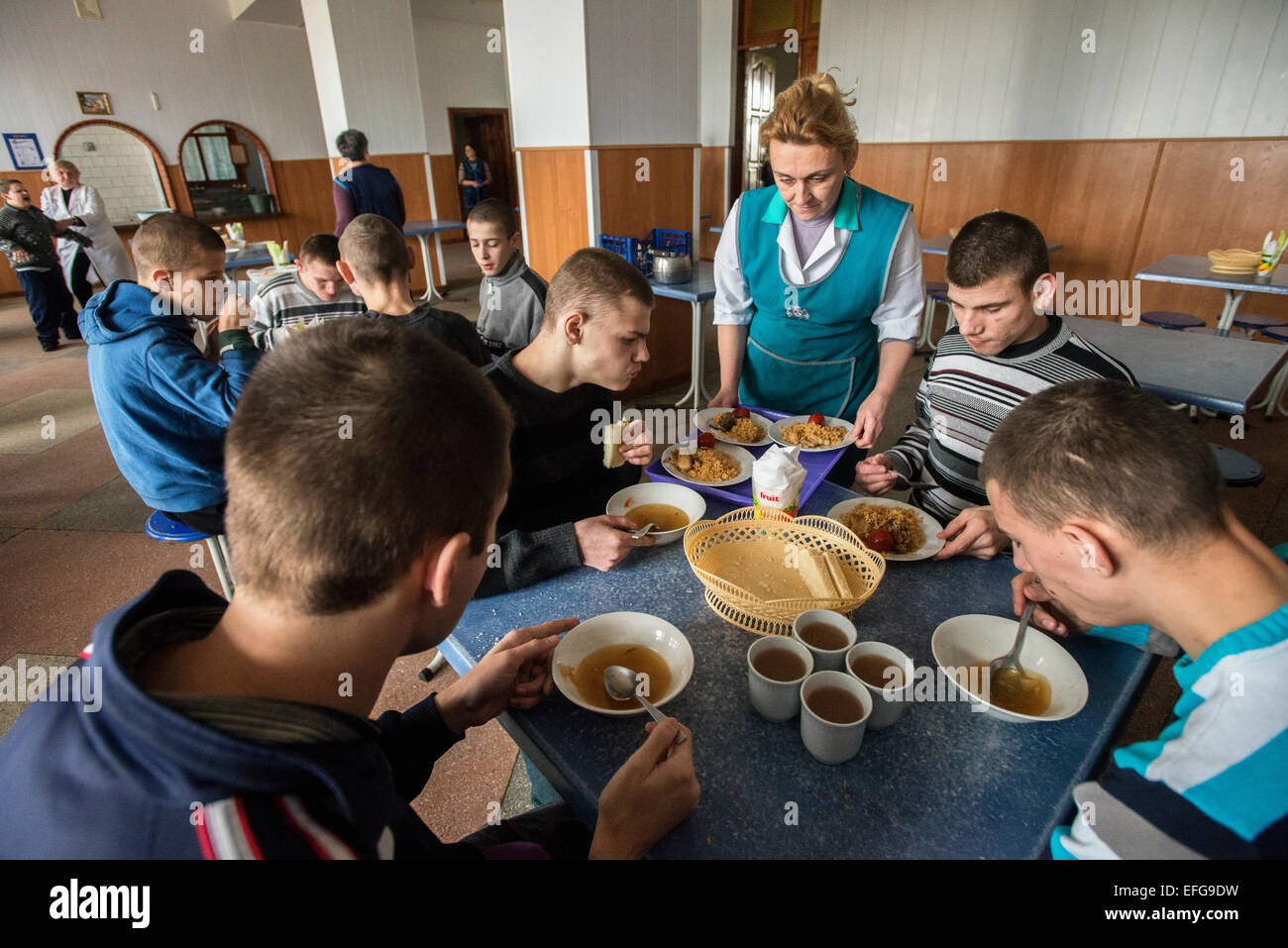 Zhytomyr, Ukraine. 2 of February, 2015. Teterivka's Orphanage and Boarding school has 85 pupils with mental and intellectual disorders, that can't manage without medical and specialists care. Governmental founding is sole way of founding for orphanage. Lunchtime, Teterivka's Orphanage and Boarding school. Zhytomyr, Ukraine. 2 of February, 2015. Credit:  Oleksandr Rupeta/Alamy Live News Stock Photo