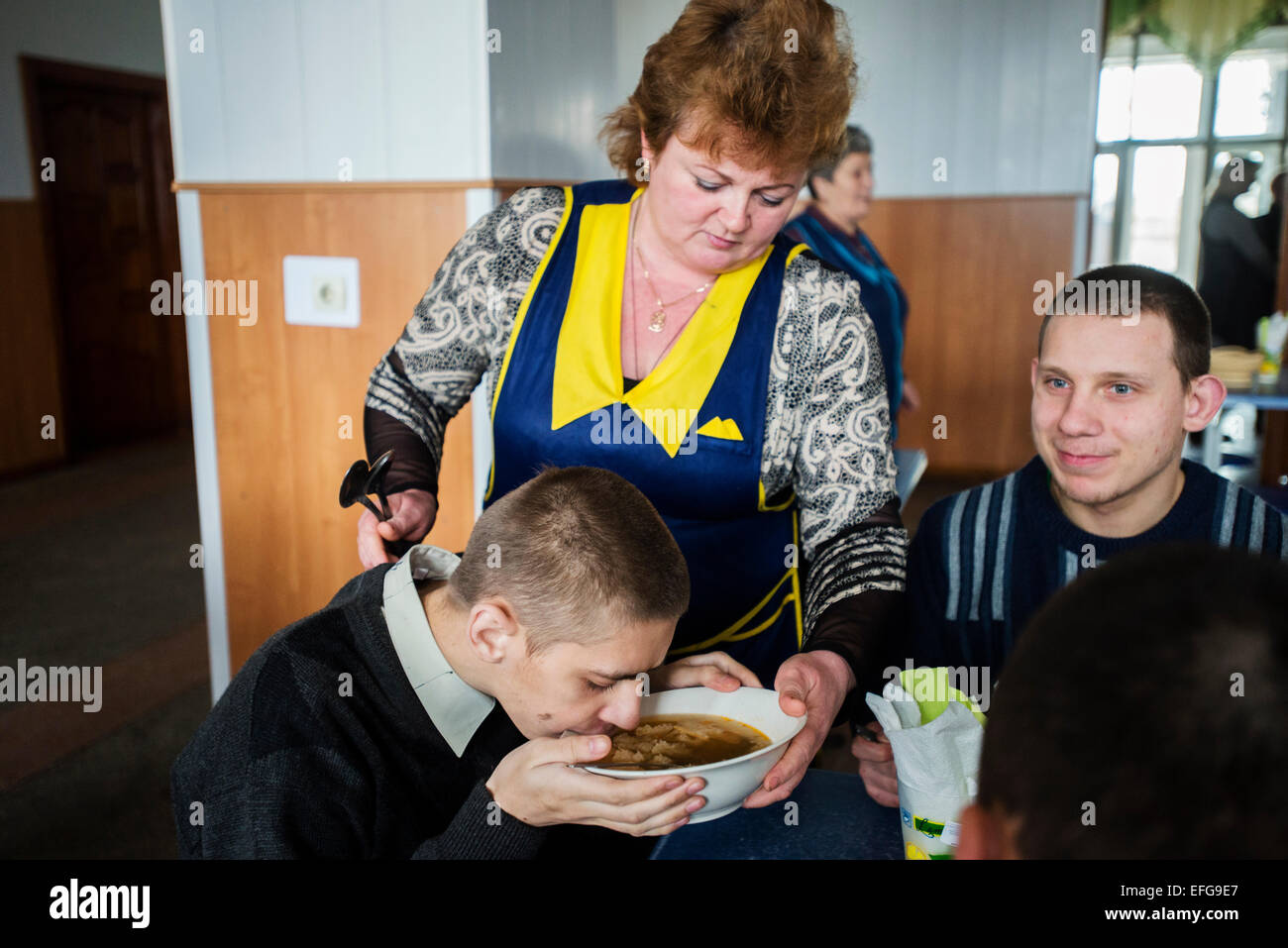 Zhytomyr, Ukraine. 2 of February, 2015. Teterivka's Orphanage and Boarding school has 85 pupils with mental and intellectual disorders, that can't manage without medical and specialists care. Governmental founding is sole way of founding for orphanage. Lunchtime, Teterivka's Orphanage and Boarding school. Zhytomyr, Ukraine. 2 of February, 2015. Credit:  Oleksandr Rupeta/Alamy Live News Stock Photo