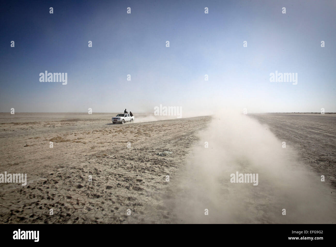 Sistan, Iran. 2nd Feb, 2015. A car runs on Hamoun wetland in Sistan-Baluchistan province, southeast Iran, on Feb. 2, 2015. Hamoun wetland has almost disappeared over the past years due to drought and climate change. Credit:  Ahmad Halabisaz/Xinhua/Alamy Live News Stock Photo