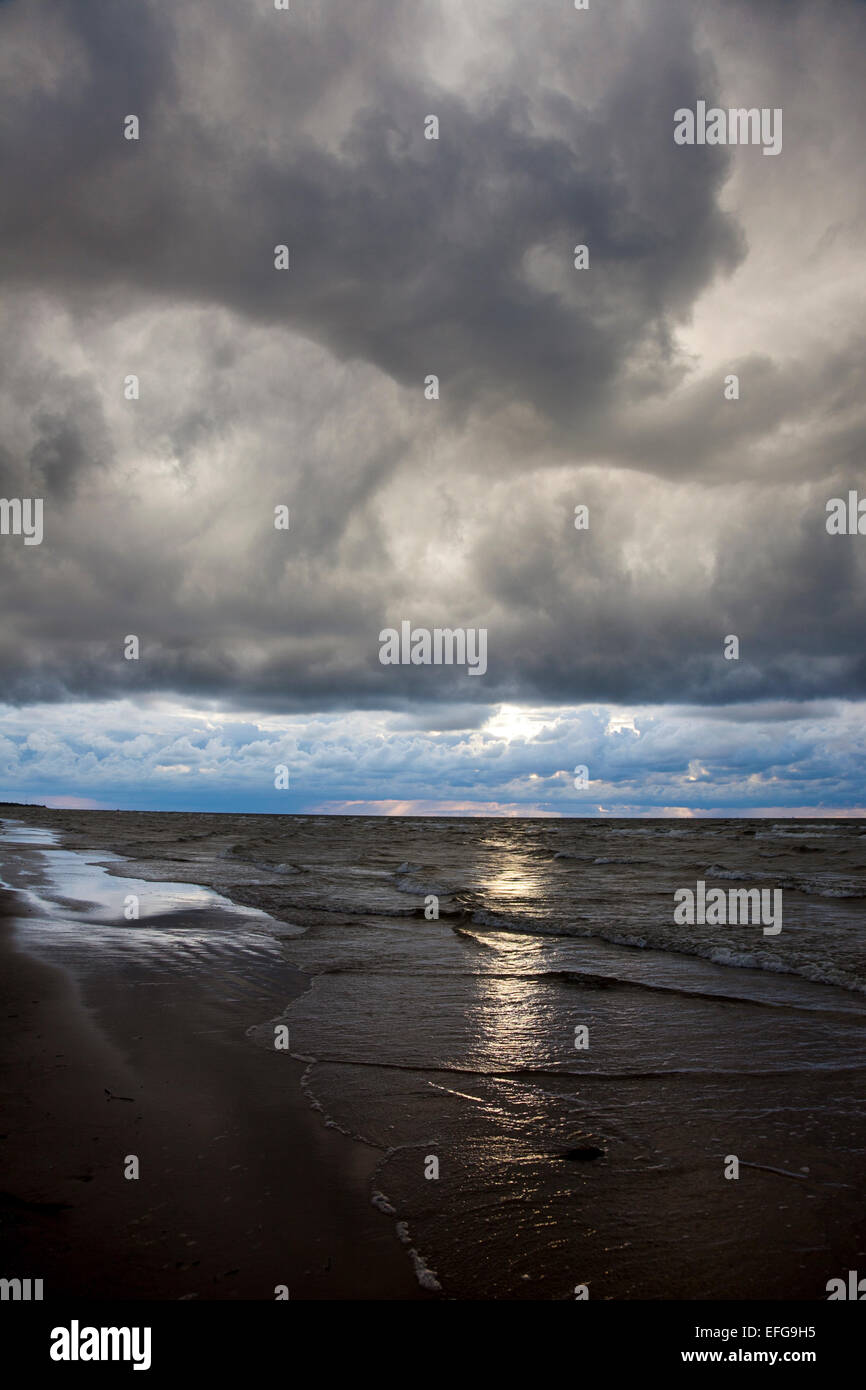Dramatic low clouds in Vecaki Beach, Riga, Latvia Stock Photo