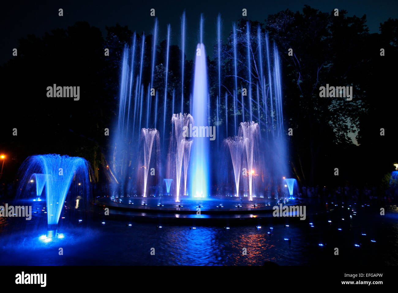 Magical fountain in Margaret Island Budapest by night . Multimedia colorful musical and light