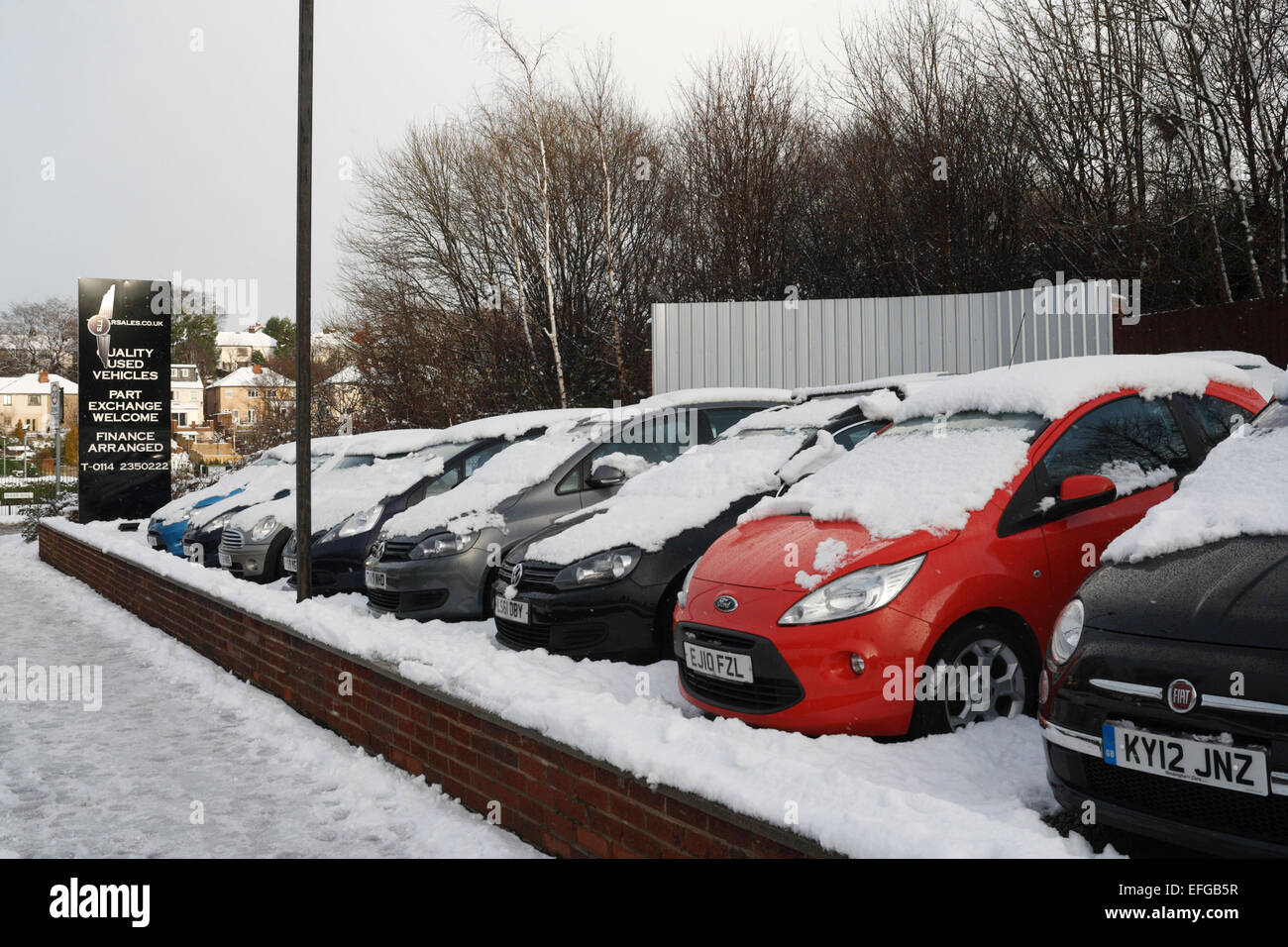 Snow covering cars for sale in a showroom Stock Photo