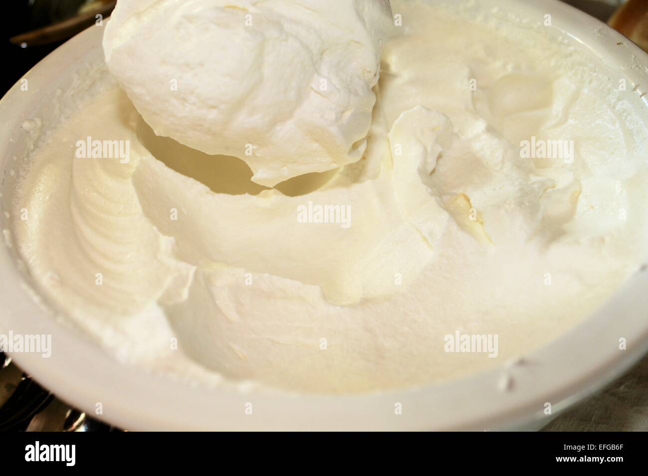 homemade whipped cream in bowl Stock Photo