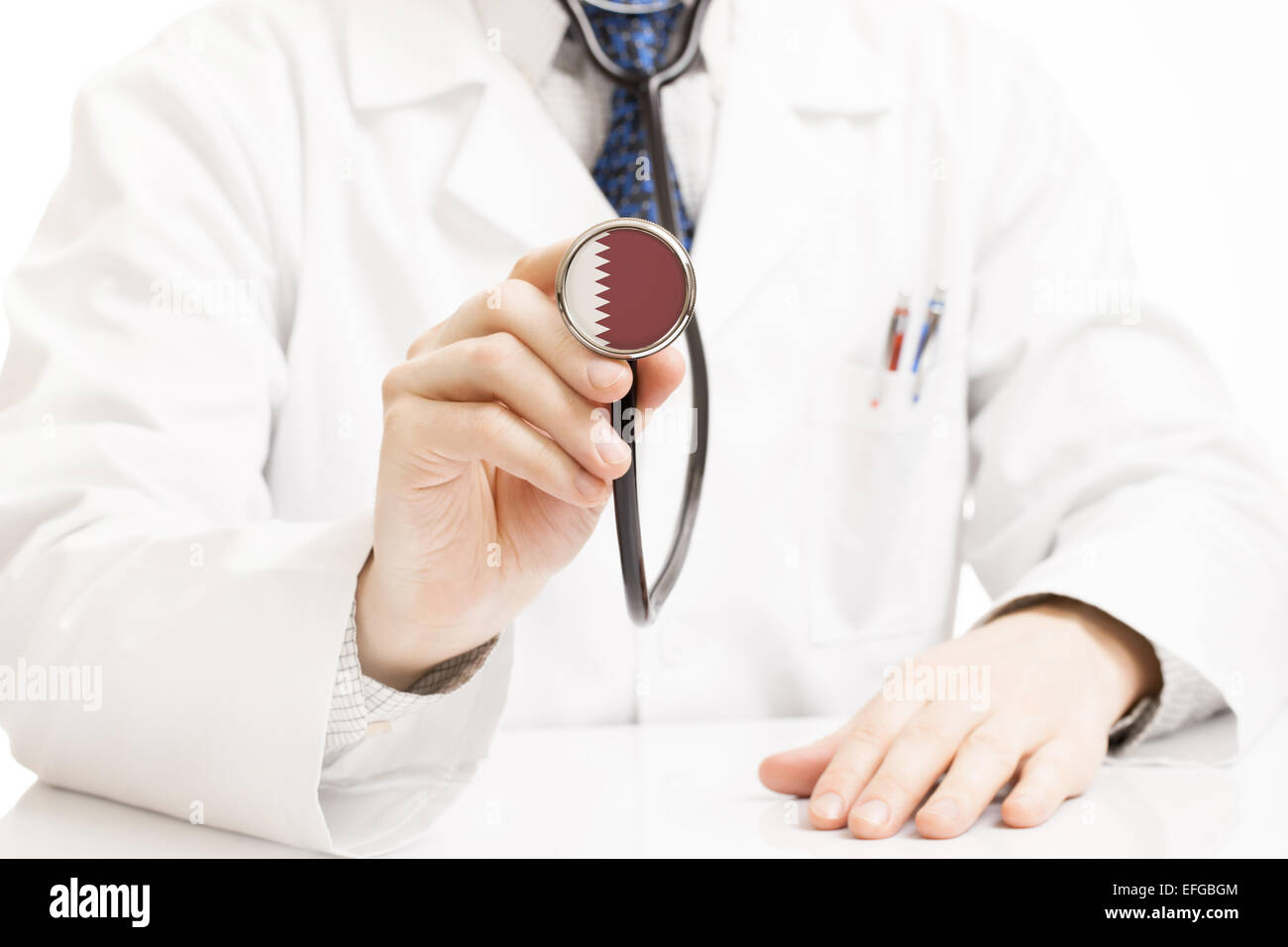 Doctor holding stethoscope with flag series Qatar Stock Photo Alamy