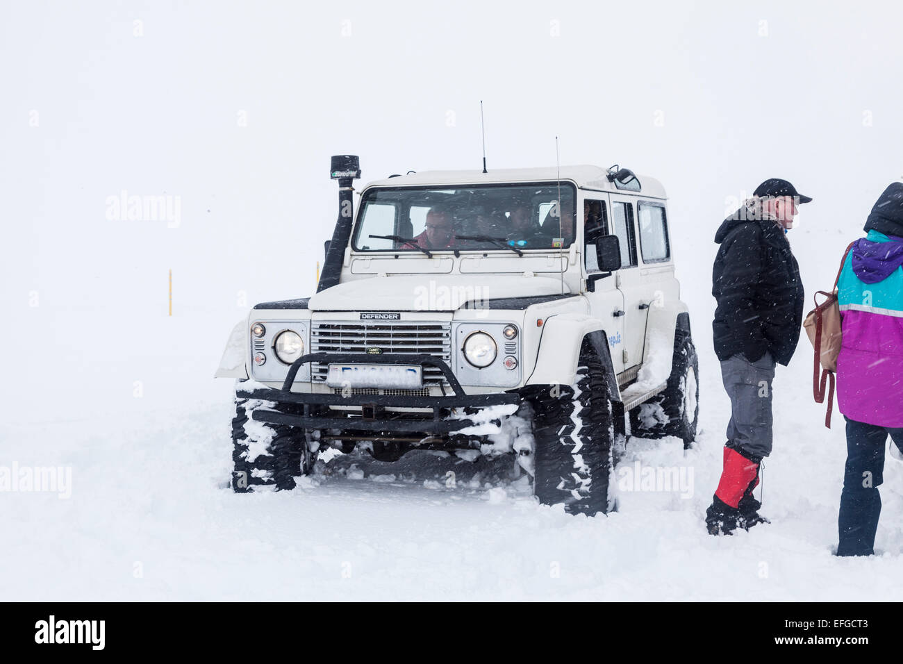 Snowy Land Rover Defender 4v4 4WD vehicle in heavy snow frozen