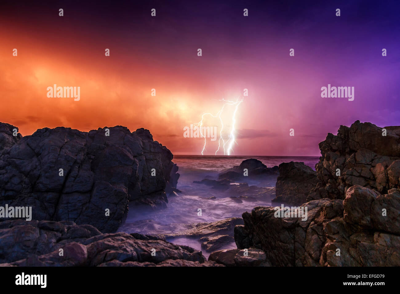 A wonderful New Years Sunrise filled with crashing waves and ferocious lightning. Stock Photo