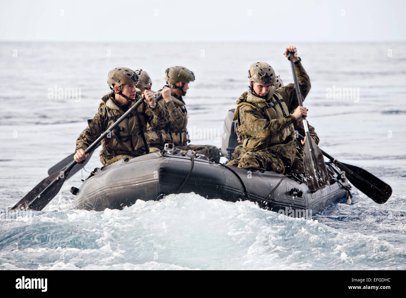 US Marines with Company F, Battalion Landing Team conduct small boat operations with a Combat Rubber Raiding Craft from the well deck of the USS Bonhomme Richard February 2, 2015. Stock Photo